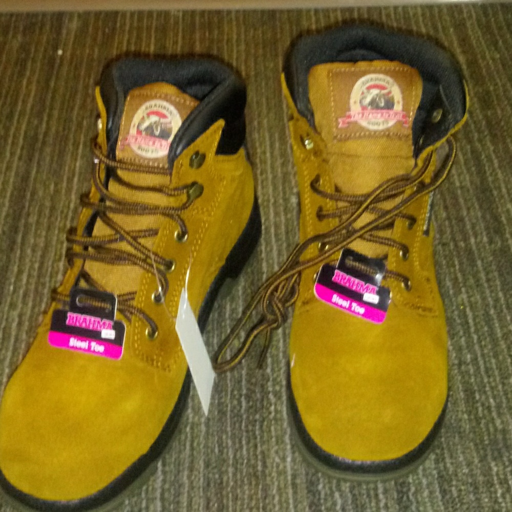 Womans 7.5 steel toes boots new waterproof